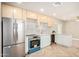 Stylish kitchen featuring modern stainless steel appliances, countertops, and updated cabinets at 2111 N Van Ness Ave, Tempe, AZ 85288