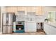 Modern kitchen featuring stainless steel appliances and sleek countertops at 2111 N Van Ness Ave, Tempe, AZ 85288