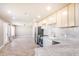 Open concept kitchen and living space featuring new stainless steel appliances at 2111 N Van Ness Ave, Tempe, AZ 85288