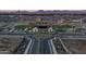 Community aerial showcasing a clubhouse, playground, green spaces, and a roundabout entrance at 23064 E Watford Dr, Queen Creek, AZ 85142