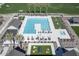 Aerial view of the community pool and lounging areas with modern furniture and well-maintained landscaping at 23064 E Watford Dr, Queen Creek, AZ 85142