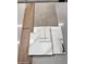 Home design material samples show carpet, tile, countertops, cabinet and flooring selections at 23064 E Watford Dr, Queen Creek, AZ 85142