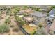 Aerial view of the house with landscaped backyard including outdoor kitchen, fire pit, and play area at 23126 N 45Th Pl, Phoenix, AZ 85050