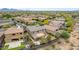 Aerial view of a two-story home with landscaped backyard, fire pit, and BBQ in desert community at 23126 N 45Th Pl, Phoenix, AZ 85050
