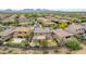 Two-story home aerial view showing landscaped backyard with covered patio and fire pit at 23126 N 45Th Pl, Phoenix, AZ 85050