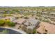 Stunning aerial view of a luxury home in a desert community, featuring tile roofing and desert landscaping at 23126 N 45Th Pl, Phoenix, AZ 85050