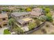 Home aerial view showing covered patio, outdoor kitchen, fire pit, landscaped backyard, and perimeter fence at 23126 N 45Th Pl, Phoenix, AZ 85050