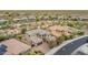 Expansive aerial view captures a desert home's tile roof, stone accents, and lush landscaping at 23126 N 45Th Pl, Phoenix, AZ 85050