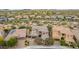 Beautiful aerial shot of a neighborhood, showcasing tile roofs, desert vegetation and well-maintained lawns at 23126 N 45Th Pl, Phoenix, AZ 85050
