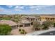 Aerial view of a two-story home with mature landscaping, tile roof, and three car garage at 23126 N 45Th Pl, Phoenix, AZ 85050