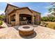 Backyard oasis includes fire pit, outdoor bar, and covered patio with outdoor lighting at 23126 N 45Th Pl, Phoenix, AZ 85050