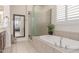 Elegant primary bathroom with a soaking tub and a frameless glass shower at 23126 N 45Th Pl, Phoenix, AZ 85050
