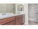 Bathroom with a double vanity and separate shower/tub combo, offering a functional space at 23126 N 45Th Pl, Phoenix, AZ 85050