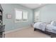Comfortable light blue bedroom with shuttered windows allowing plenty of natural light at 23126 N 45Th Pl, Phoenix, AZ 85050