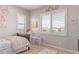 Bright bedroom with a window and decorative wall art that creates a cozy atmosphere at 23126 N 45Th Pl, Phoenix, AZ 85050