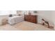Stylishly decorated bedroom with rocking horse, large dresser, and accent pillows on the bed at 23126 N 45Th Pl, Phoenix, AZ 85050
