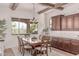Bright dining room featuring wood beam ceiling and view to patio at 23126 N 45Th Pl, Phoenix, AZ 85050