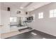 Home gym with treadmills, mirrors, TV and speakers for a complete workout space at 23126 N 45Th Pl, Phoenix, AZ 85050