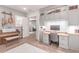 Cozy home office featuring a piano and built-in desk with overhead cabinets, perfect for work and hobbies at 23126 N 45Th Pl, Phoenix, AZ 85050