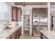 Modern kitchen with stainless steel appliances, granite countertops, and a large pantry at 23126 N 45Th Pl, Phoenix, AZ 85050