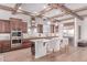 Gourmet kitchen with stainless steel appliances, granite countertops, and a large center island at 23126 N 45Th Pl, Phoenix, AZ 85050