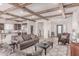 Spacious living area with wood beam ceilings open to kitchen and dining at 23126 N 45Th Pl, Phoenix, AZ 85050