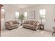 Inviting living room with large windows, comfortable seating, and stylish décor, perfect for relaxation at 23126 N 45Th Pl, Phoenix, AZ 85050