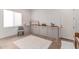 Cozy home office with built-in storage and a large window providing natural light at 23126 N 45Th Pl, Phoenix, AZ 85050