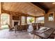 A beautiful outdoor patio is complete with stone fireplace, outdoor seating, and grill at 23126 N 45Th Pl, Phoenix, AZ 85050