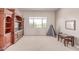 Spacious playroom with large windows, a modern TV console, and a play area for Gathering fun at 23126 N 45Th Pl, Phoenix, AZ 85050