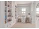 Bright study room with built-in bookshelves and a well-lit desk, ideal for focus and productivity at 23126 N 45Th Pl, Phoenix, AZ 85050