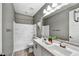 Well-appointed bathroom with double vanity, tub/shower combo and updated fixtures offers comfort and convenience at 25326 N 19Th Dr, Phoenix, AZ 85085