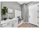 Charming entryway boasts a built-in bench, storage cabinets, and stylish decor for a welcoming first impression at 25326 N 19Th Dr, Phoenix, AZ 85085