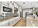Well-equipped kitchen with sleek cabinetry, stainless steel appliances, and an eye-catching tile backsplash at 25326 N 19Th Dr, Phoenix, AZ 85085