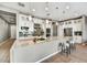 Stunning kitchen featuring a large island, ample cabinetry, stainless steel appliances, and stylish backsplash at 25326 N 19Th Dr, Phoenix, AZ 85085