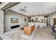 Inviting living room with stylish furnishings, large windows, and open access to the gourmet kitchen at 25326 N 19Th Dr, Phoenix, AZ 85085