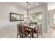 Dining room with large mirror, updated lighting, and large table with seating for eight at 27105 W Marco Polo Rd, Buckeye, AZ 85396