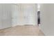 Bright entryway with tile flooring and large coat closet with white doors at 27105 W Marco Polo Rd, Buckeye, AZ 85396