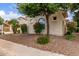 Landscaped yard featuring desert plants, rock cover, and charming desert bushes at 27105 W Marco Polo Rd, Buckeye, AZ 85396