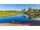 Community water feature of a pond on the golf course at 27105 W Marco Polo Rd, Buckeye, AZ 85396