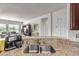 Granite countertops, stainless steel sink, and open-concept layout create an ideal kitchen area at 27105 W Marco Polo Rd, Buckeye, AZ 85396