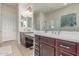 Elegant bathroom showcasing dual vanities, a large mirror, and abundant counter space at 27105 W Marco Polo Rd, Buckeye, AZ 85396