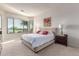 Spacious main bedroom with plush carpeting, a large window, and elegant furnishings at 27105 W Marco Polo Rd, Buckeye, AZ 85396