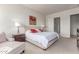 Inviting main bedroom featuring soft colors, bedside tables, and an ensuite bathroom at 27105 W Marco Polo Rd, Buckeye, AZ 85396