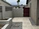Backyard with pavers and gray gravel. Contains a fenced-in entryway at 3021 E Shangri La Rd, Phoenix, AZ 85028