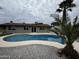 Backyard oasis featuring a private pool and a charming, well-maintained landscape at 3021 E Shangri La Rd, Phoenix, AZ 85028
