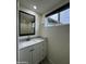 Bathroom featuring a modern vanity, sleek mirror, and updated lighting at 3021 E Shangri La Rd, Phoenix, AZ 85028