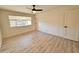 Bright bedroom featuring neutral walls, modern flooring, and a ceiling fan at 3021 E Shangri La Rd, Phoenix, AZ 85028