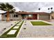 Attractive home with desert landscaping featuring a green astro-turf pathway and cacti at 3021 E Shangri La Rd, Phoenix, AZ 85028