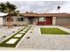 Home exterior featuring desert landscaping, including cacti and white gravel at 3021 E Shangri La Rd, Phoenix, AZ 85028